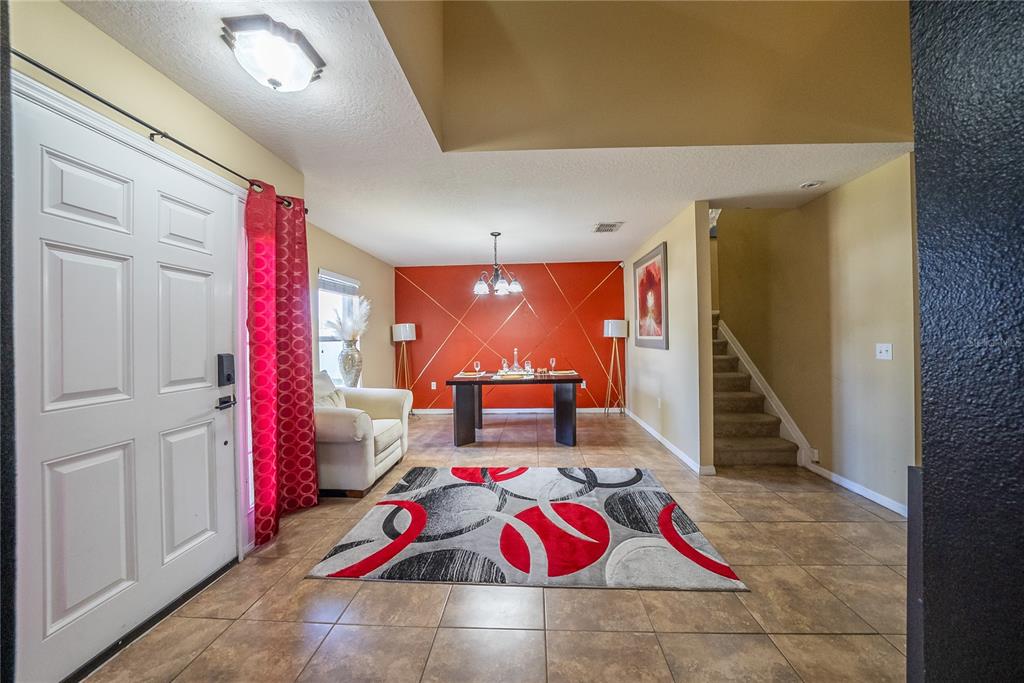 5306 Southwest 115th Street Road Ocala, FL 34476 - Photo 26 of 56 a living room with a couch