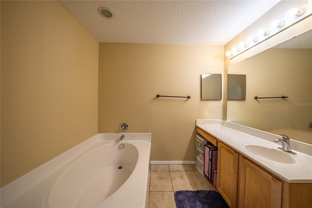 5306 Southwest 115th Street Road Ocala, FL 34476 - Photo 41 of 56 a bathroom with a sink and mirror