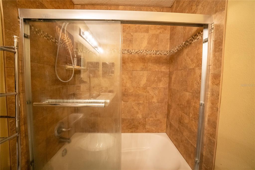 5306 Southwest 115th Street Road Ocala, FL 34476 - Photo 44 of 56 a bathroom with a shower
