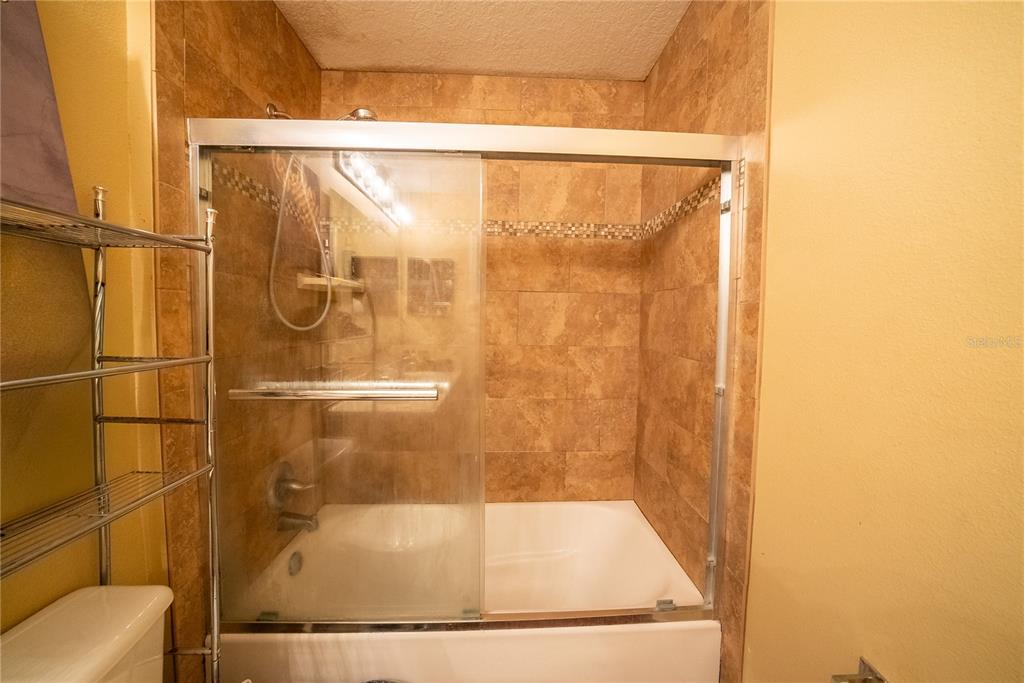 5306 Southwest 115th Street Road Ocala, FL 34476 - Photo 45 of 56 a bathroom with a shower