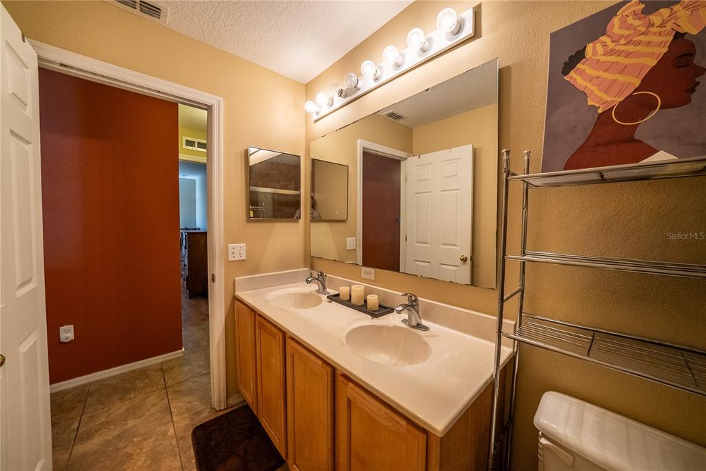 5306 Southwest 115th Street Road Ocala, FL 34476 - Photo 46 of 56 a bathroom with a sink and a mirror