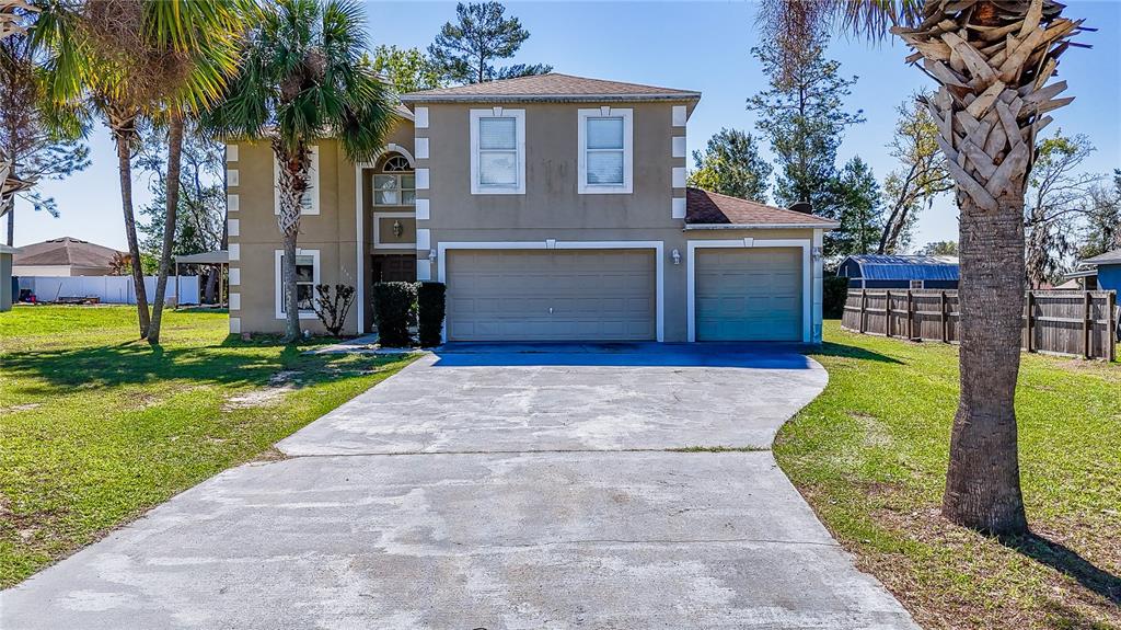 5306 Southwest 115th Street Road Ocala, FL 34476 - Photo 47 of 56 a house view with a garden space