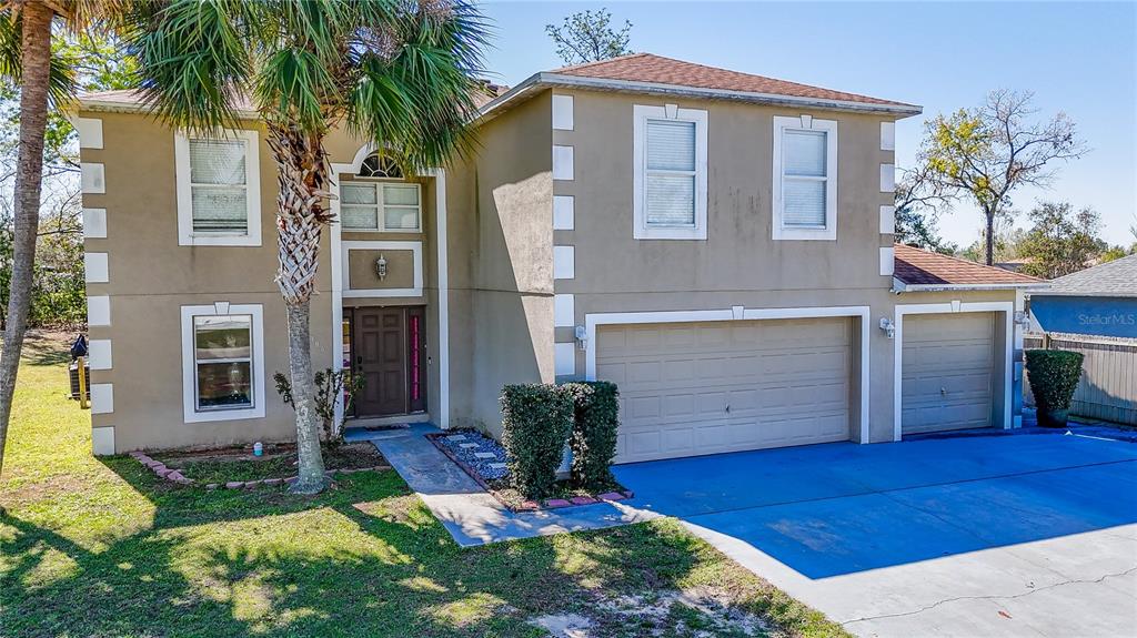 5306 Southwest 115th Street Road Ocala, FL 34476 - Photo 49 of 56 a front view of a house with garden