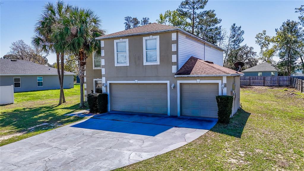 5306 Southwest 115th Street Road Ocala, FL 34476 - Photo 50 of 56 a view of a house with a yard