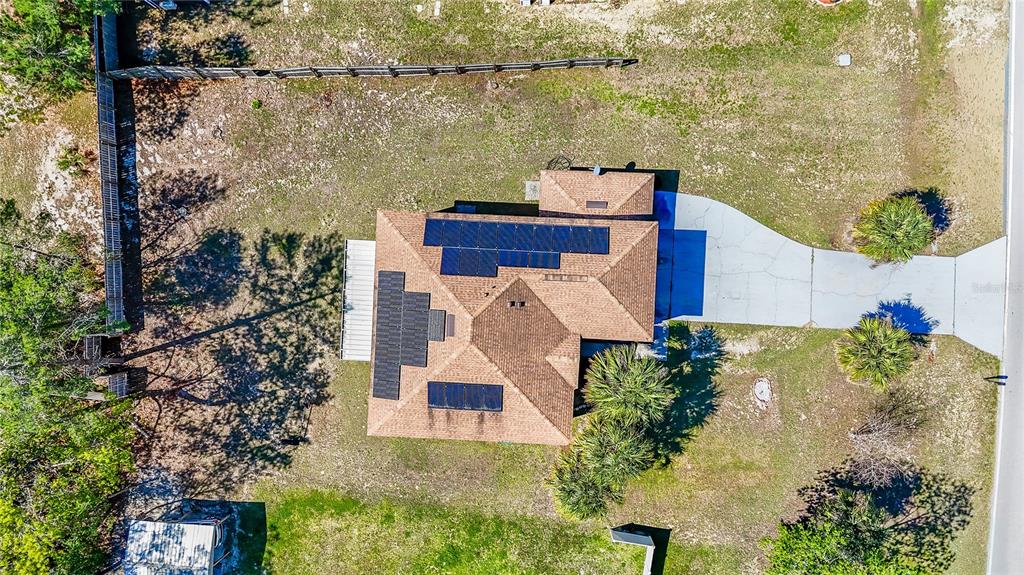 5306 Southwest 115th Street Road Ocala, FL 34476 - Photo 51 of 56 an aerial view of a house with a yard