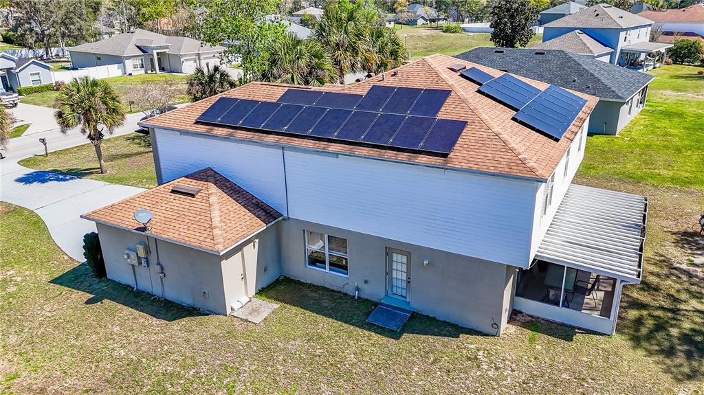 5306 Southwest 115th Street Road Ocala, FL 34476 - Photo 53 of 56 a view of a house with a yard
