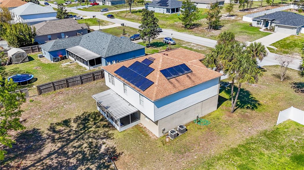5306 Southwest 115th Street Road Ocala, FL 34476 - Photo 54 of 56 an aerial view of a house with swimming pool and outdoor seating