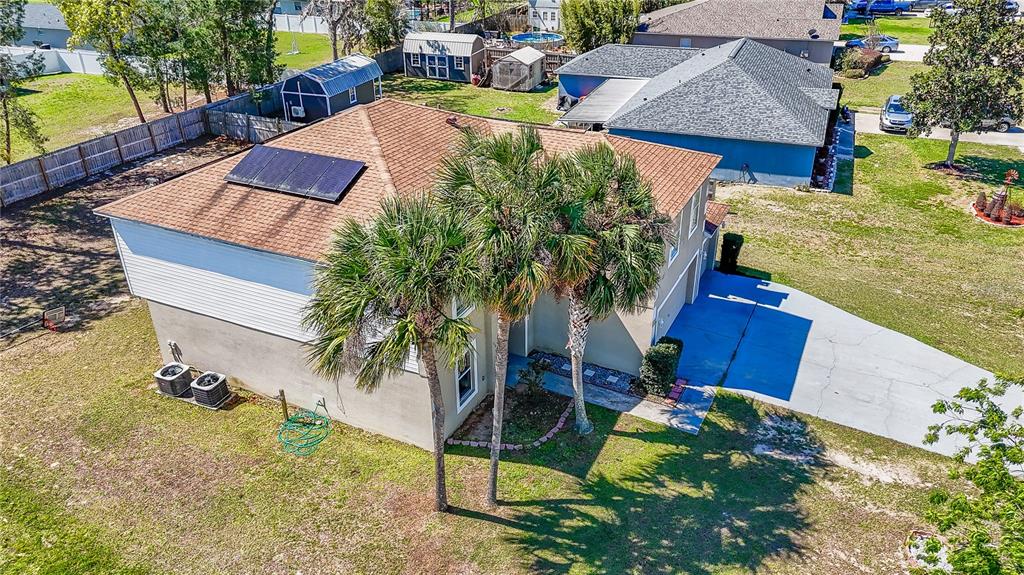 5306 Southwest 115th Street Road Ocala, FL 34476 - Photo 55 of 56 an aerial view of a house with swimming pool and large trees