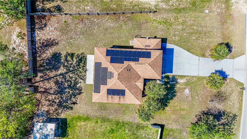 5306 Southwest 115th Street Road Ocala, FL 34476 - Photo 56 of 56 aerial view of a house with a lake view