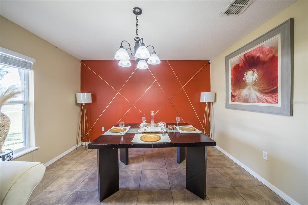 5306 Southwest 115th Street Road Ocala, FL 34476 - Photo 6 of 56 a view of a room with furniture and window