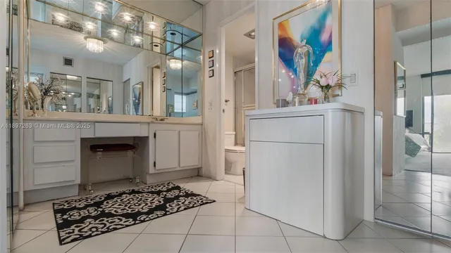 a bathroom with a painting on the wall and a shower