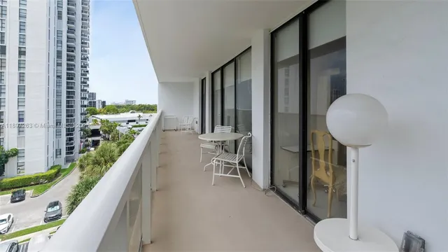 a view of balcony with furniture