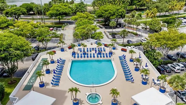 a view of a swimming pool with a lounge chairs