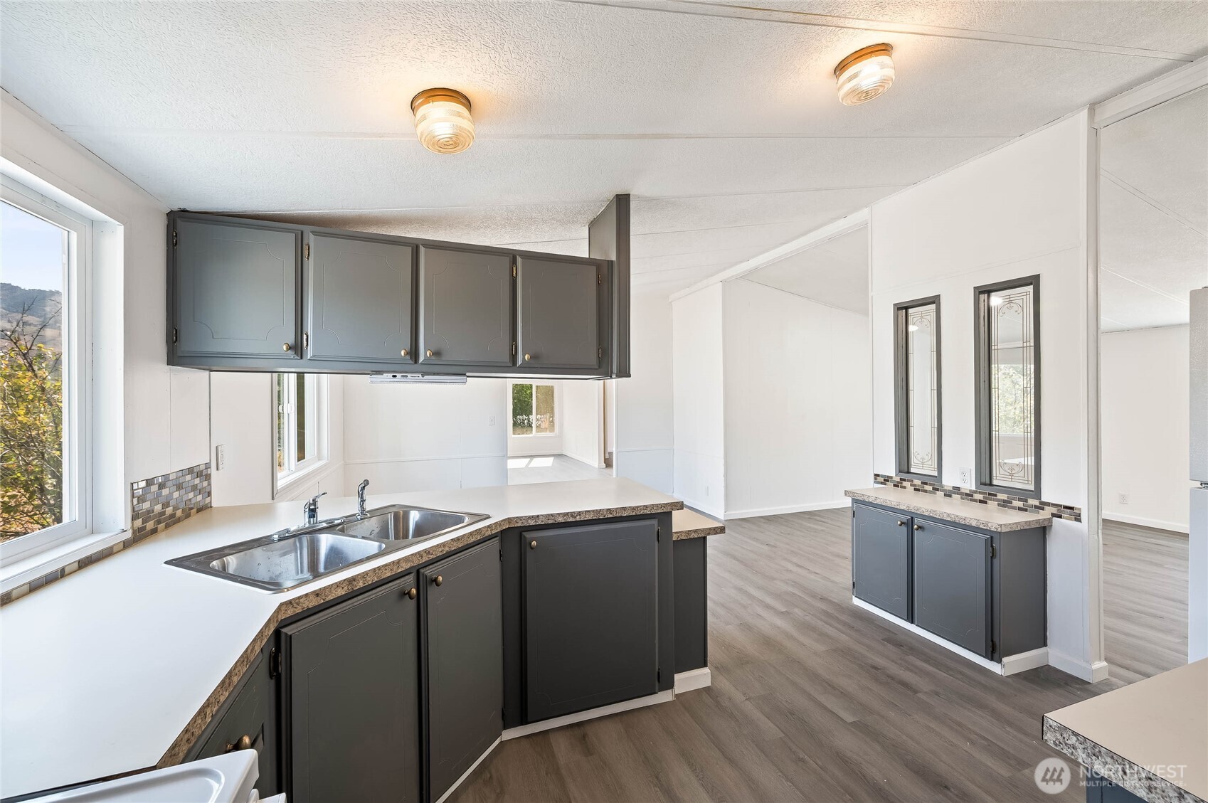 138 Trestle View Lane Cashmere, WA 98815 - Photo 17 of 30 a kitchen with a sink cabinets and window