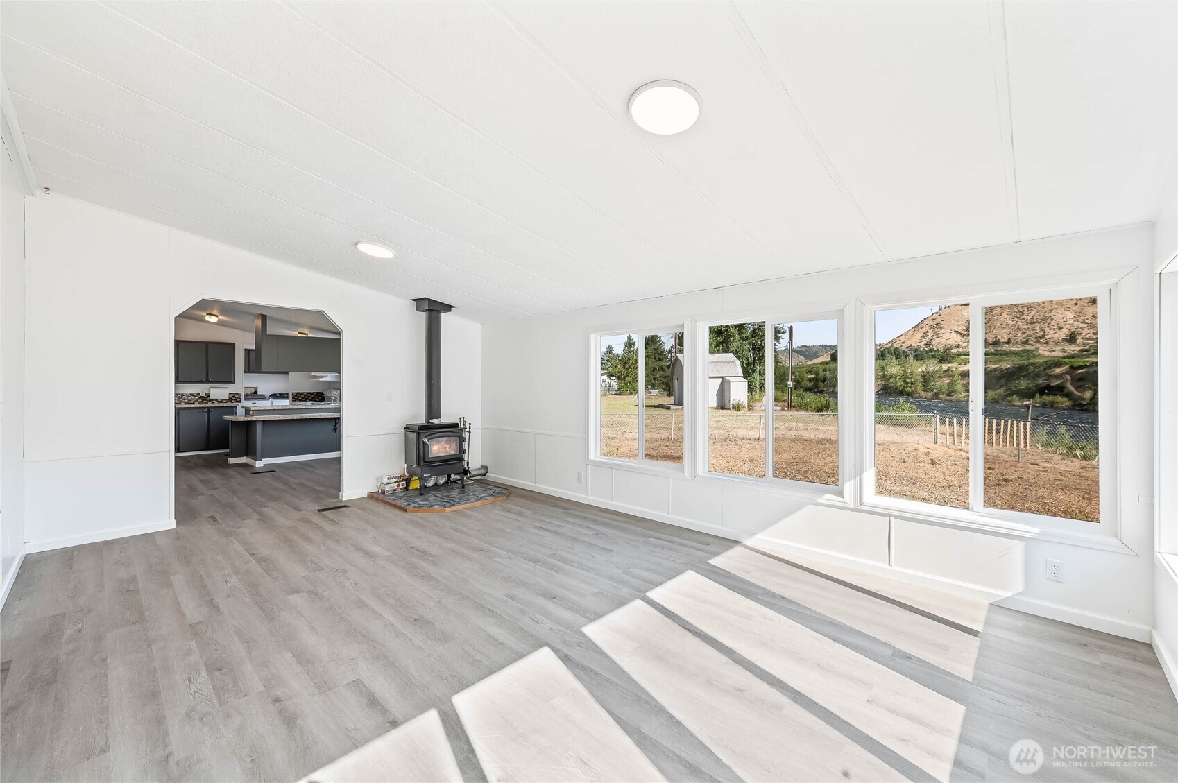 138 Trestle View Lane Cashmere, WA 98815 - Photo 19 of 30 a view of an empty room with a window and wooden floor