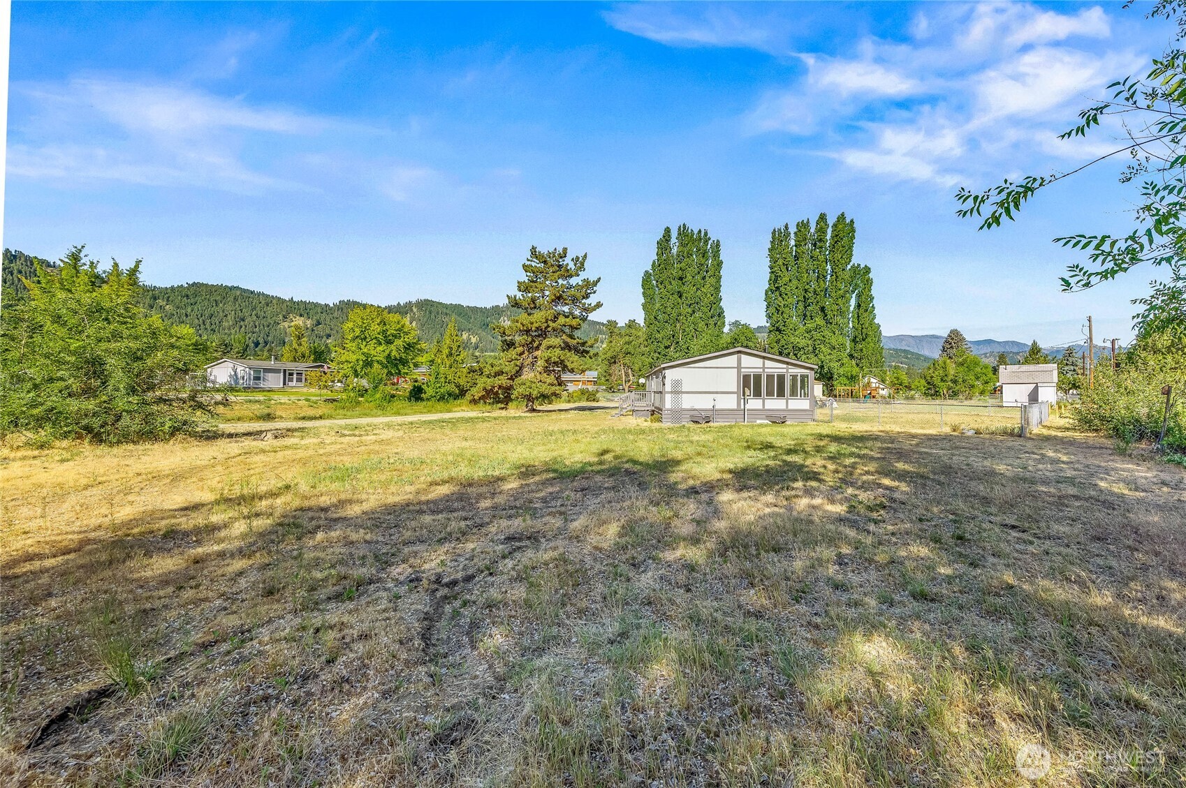138 Trestle View Lane Cashmere, WA 98815 - Photo 26 of 30 a view of a field with an ocean and trees