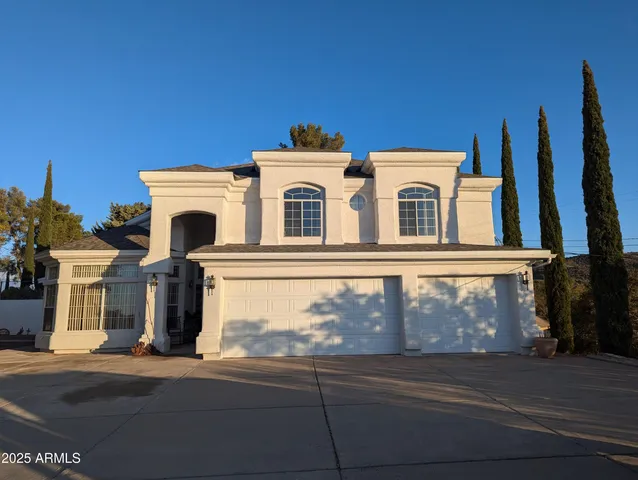 a front view of a house with a garage