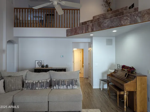 a bedroom with furniture and a wooden floor