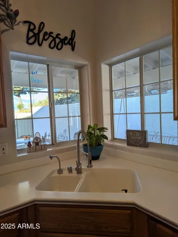 a bathroom with a bathtub and next to a window