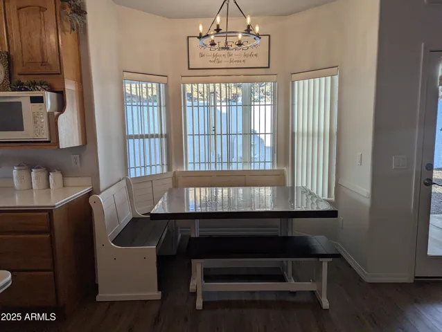 a dining room with furniture and window
