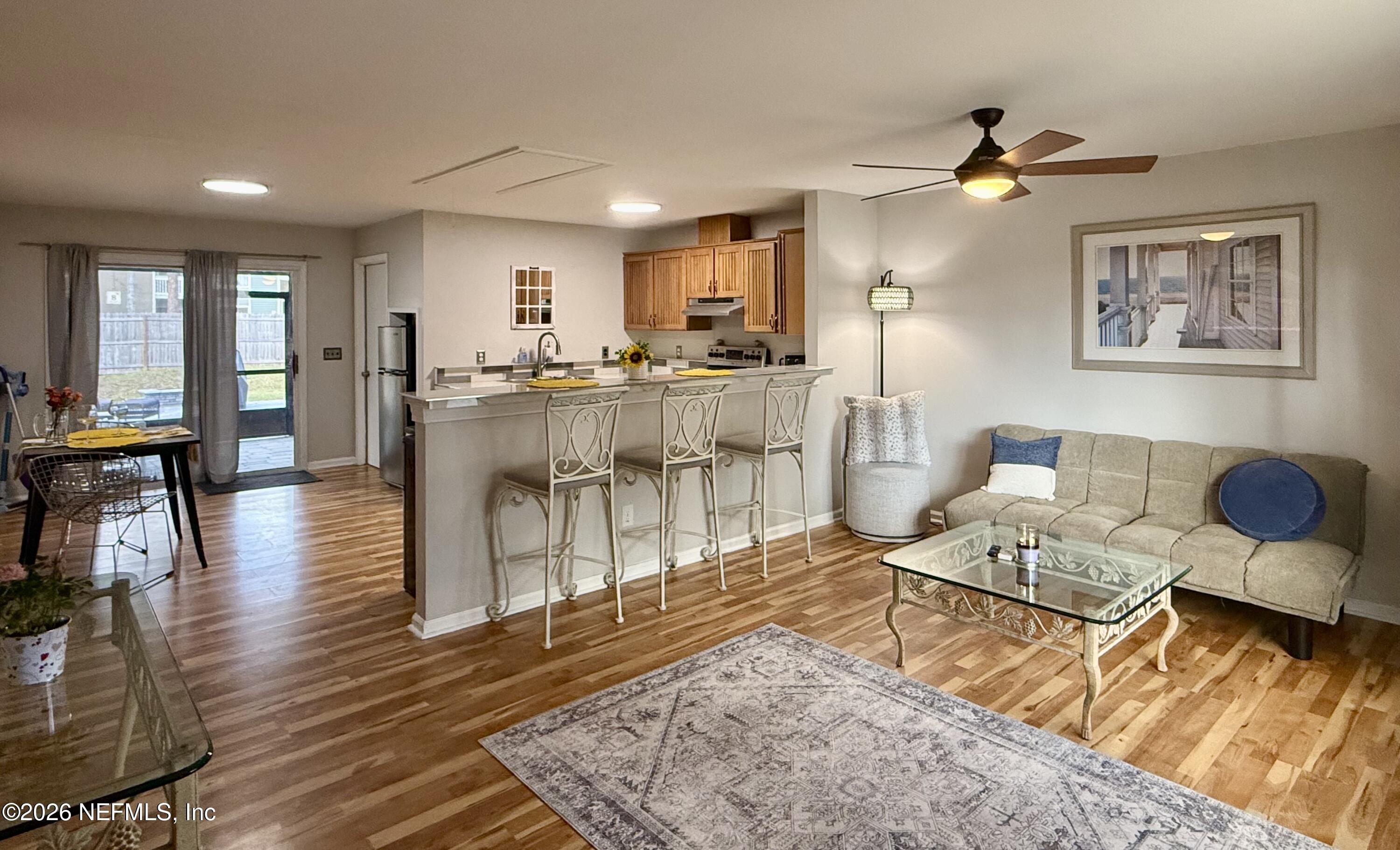 3173 Ricky Drive Jacksonville, FL 32223 - Photo 2 of 12 a living room with furniture and wooden floor