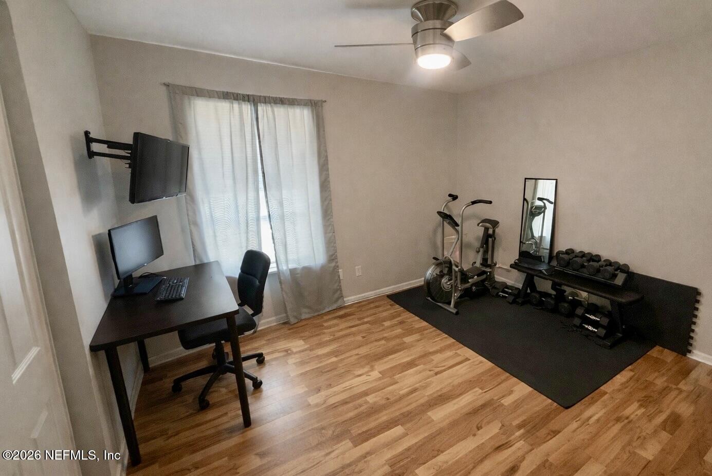 3173 Ricky Drive Jacksonville, FL 32223 - Photo 4 of 12 a view of a workspace with furniture and a window