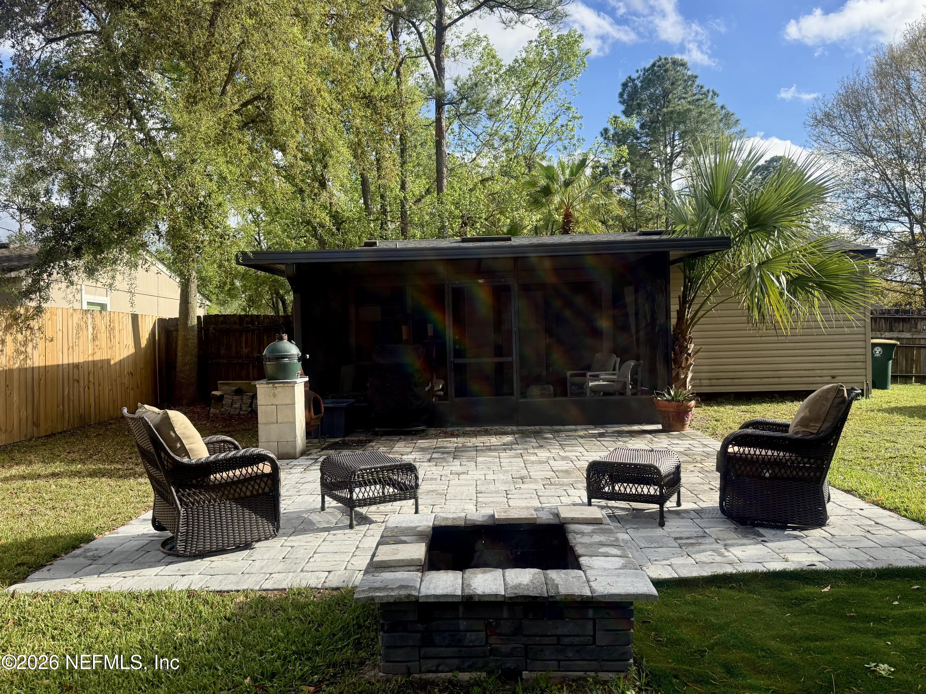 3173 Ricky Drive Jacksonville, FL 32223 - Photo 7 of 12 a backyard of a house with seating space