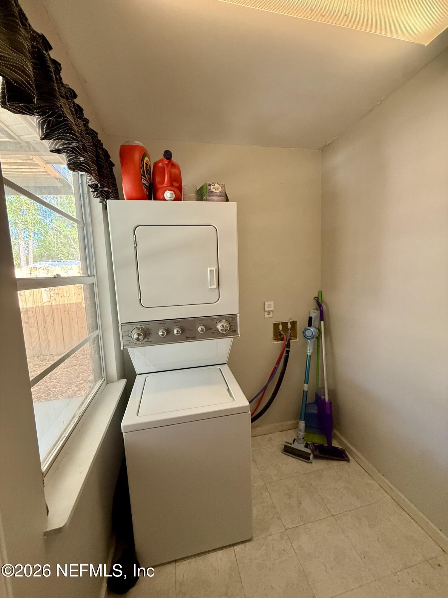 3173 Ricky Drive Jacksonville, FL 32223 - Photo 8 of 12 a utility room with dryer and washer