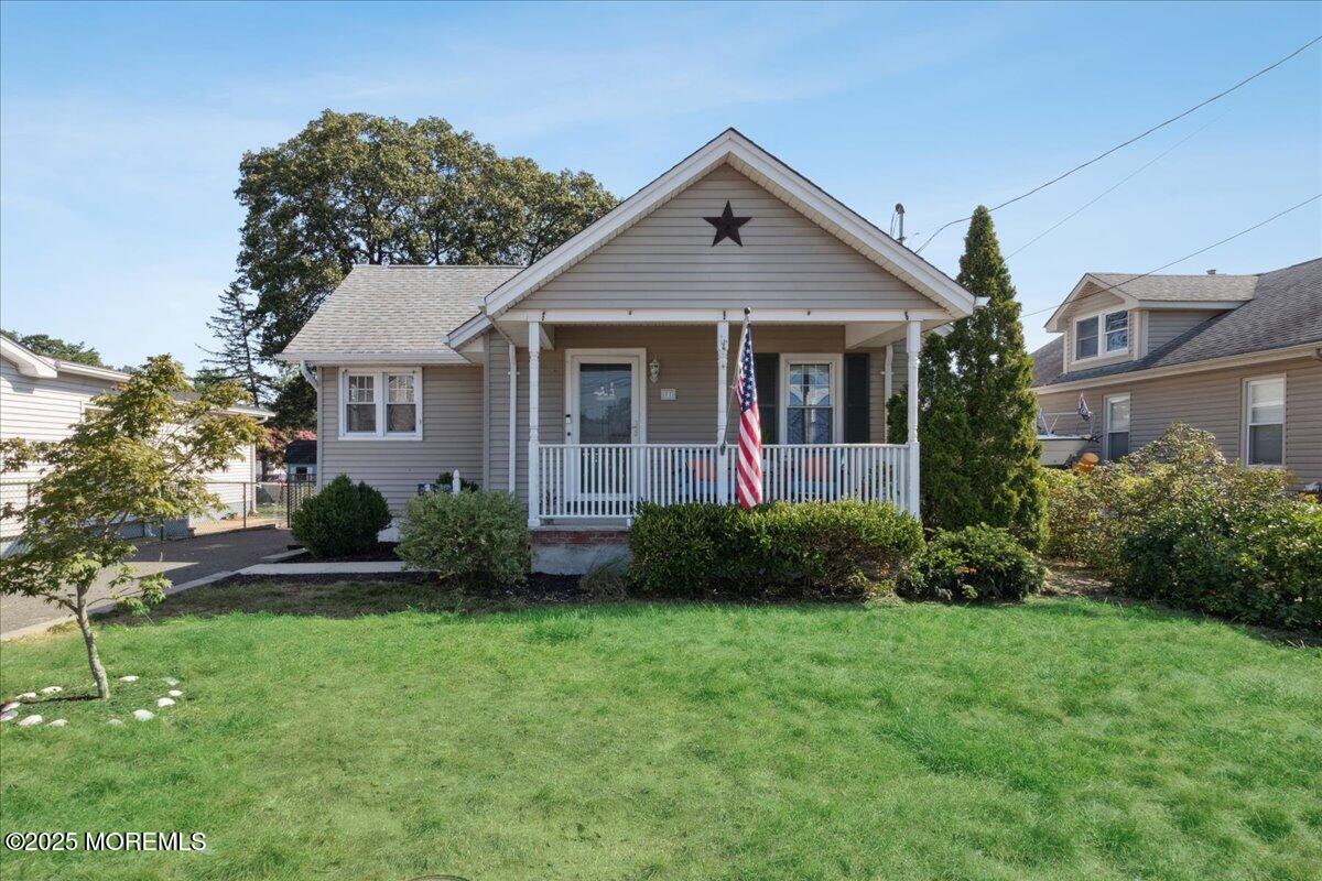 77 Drift Road Belford, NJ 07718 - Photo 1 of 23 a view of a house with garden and yard
