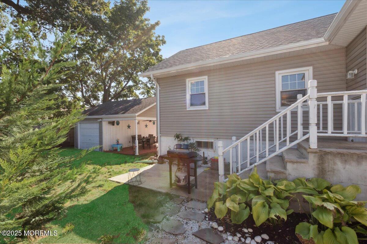 77 Drift Road Belford, NJ 07718 - Photo 23 of 23 a view of a house with backyard and sitting area