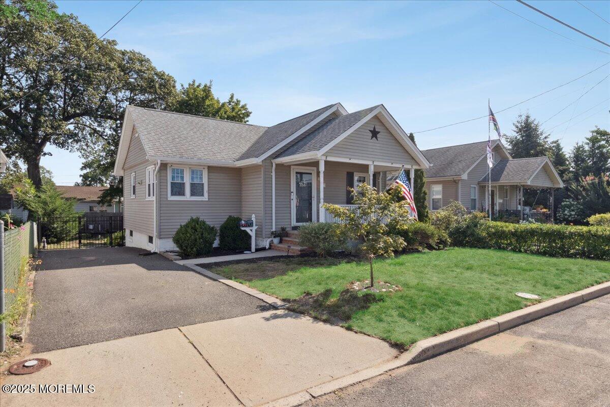 77 Drift Road Belford, NJ 07718 - Photo 3 of 23 a front view of a house with a yard and garage