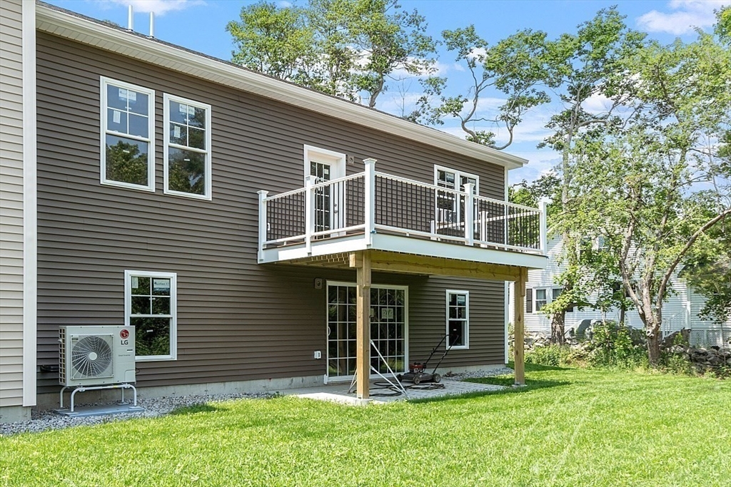 94 Fitchburg Road, Unit 2 Townsend, MA 01469 - Photo 25 of 31 a front view of a house with a yard