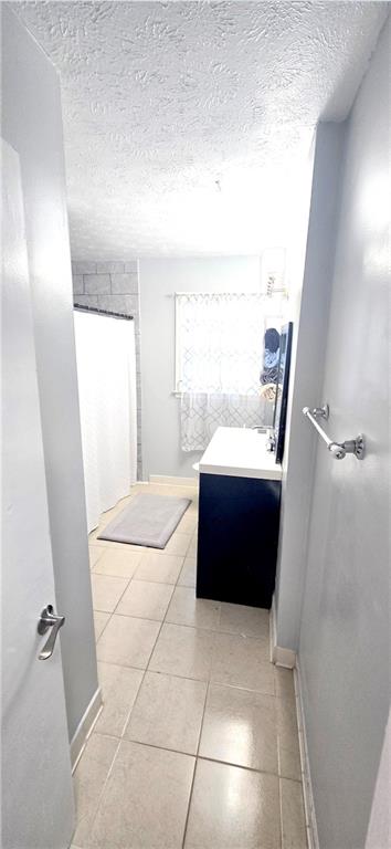 4034 Weeks Drive Kennesaw, GA 30144 - Photo 11 of 24 a bathroom with a bathtub and shower