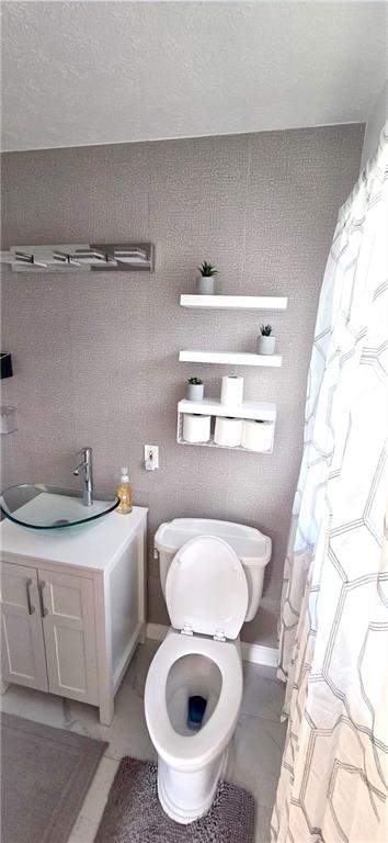 4034 Weeks Drive Kennesaw, GA 30144 - Photo 19 of 24 a bathroom with a sink a toilet and a mirror