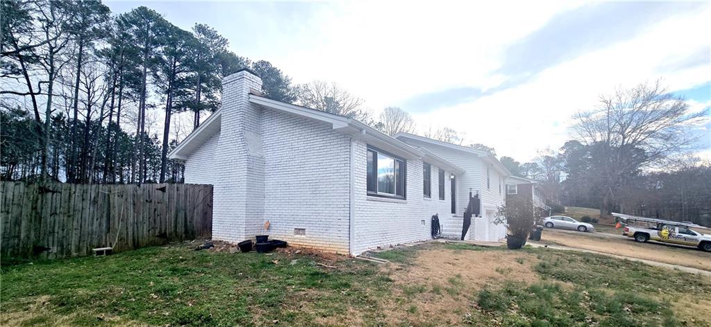 4034 Weeks Drive Kennesaw, GA 30144 - Photo 2 of 24 a backyard of a house with lots of green space