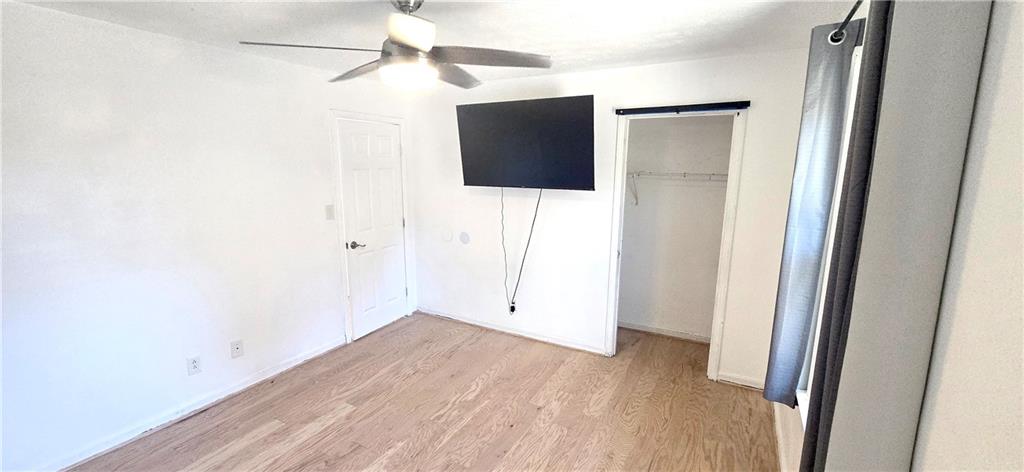 4034 Weeks Drive Kennesaw, GA 30144 - Photo 22 of 24 a view of a hallway with wooden floor