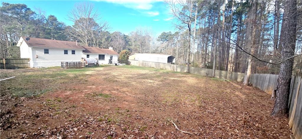 4034 Weeks Drive Kennesaw, GA 30144 - Photo 6 of 24 a view of a house with a yard