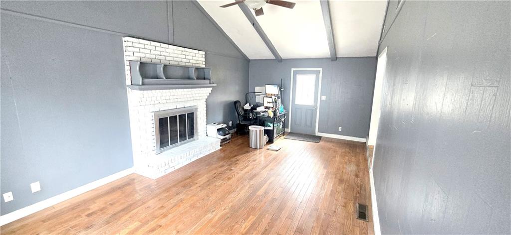 4034 Weeks Drive Kennesaw, GA 30144 - Photo 9 of 24 a view of a livingroom with wooden floor and a fireplace