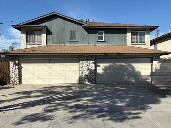 a front view of a house with a garage