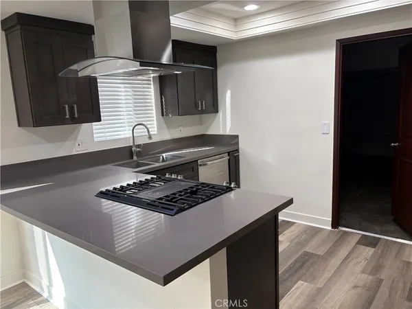 a kitchen with a stove and a refrigerator