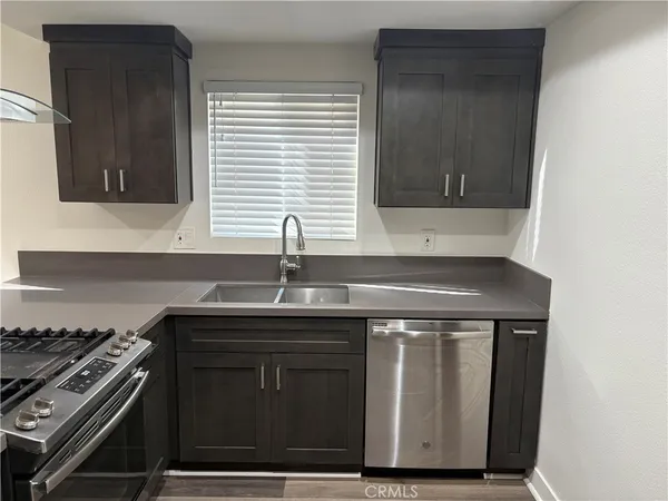 a kitchen with a sink and a stove