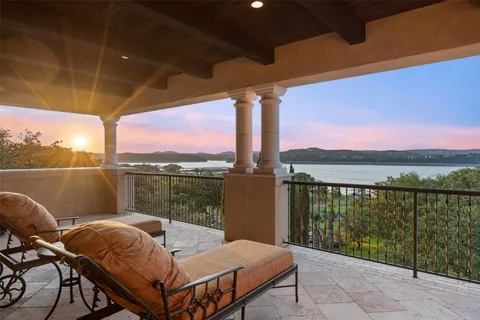 a view of a balcony with lake view and mountain view