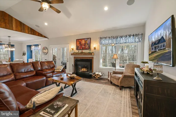a large kitchen with a table and chairs