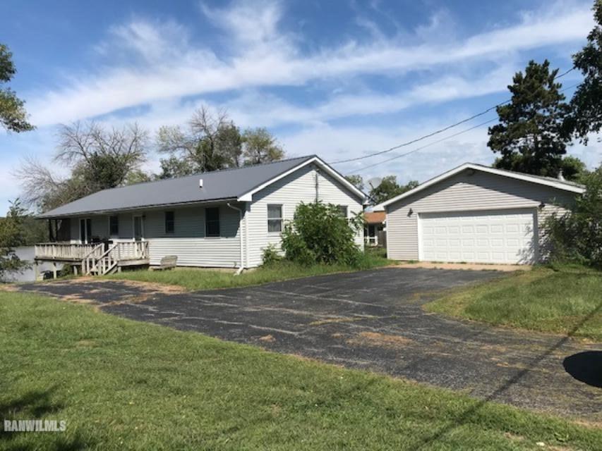 5808 Riverview Road Thomson, IL 61285 - Photo 2 of 9 a front view of house with yard and trees in the background