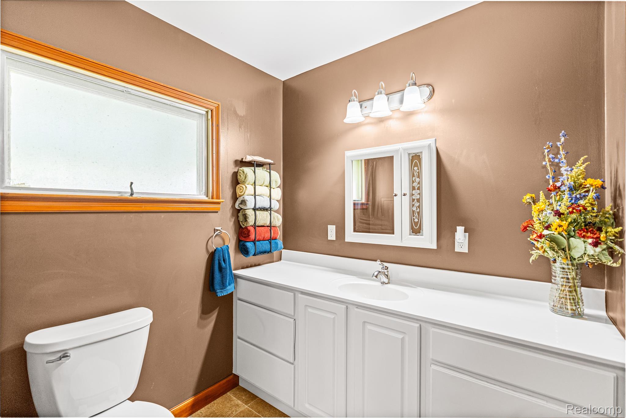 6383 Lapeer Road Burton, MI 48509 - Photo 19 of 44 Half bath featuring vanity and toilet