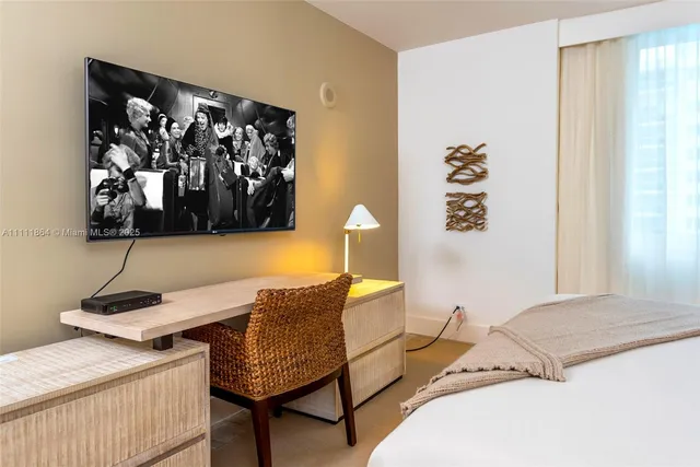 a bedroom with a bed and a table in it