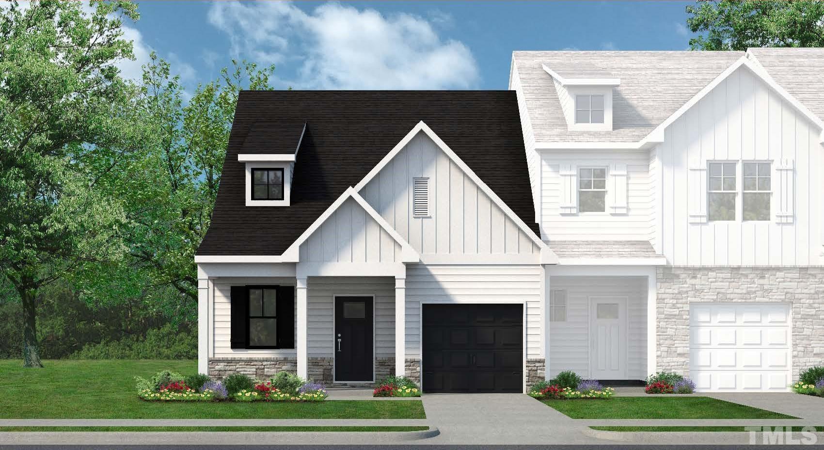 741 Riley Hill Road, Unit 140 Zebulon, NC 27597 - Photo 1 of 2 a front view of a house with a yard