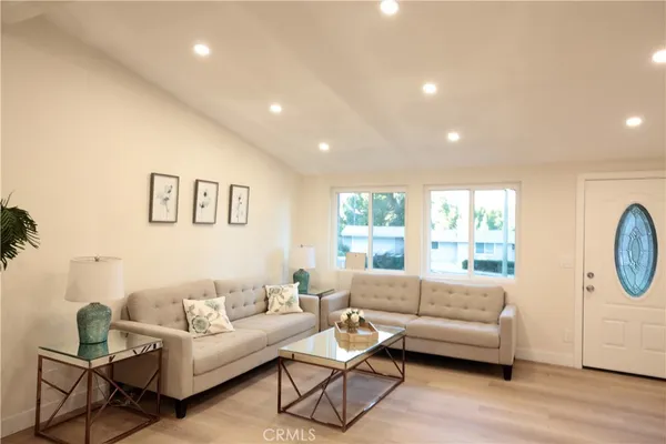 a living room with furniture and a large window