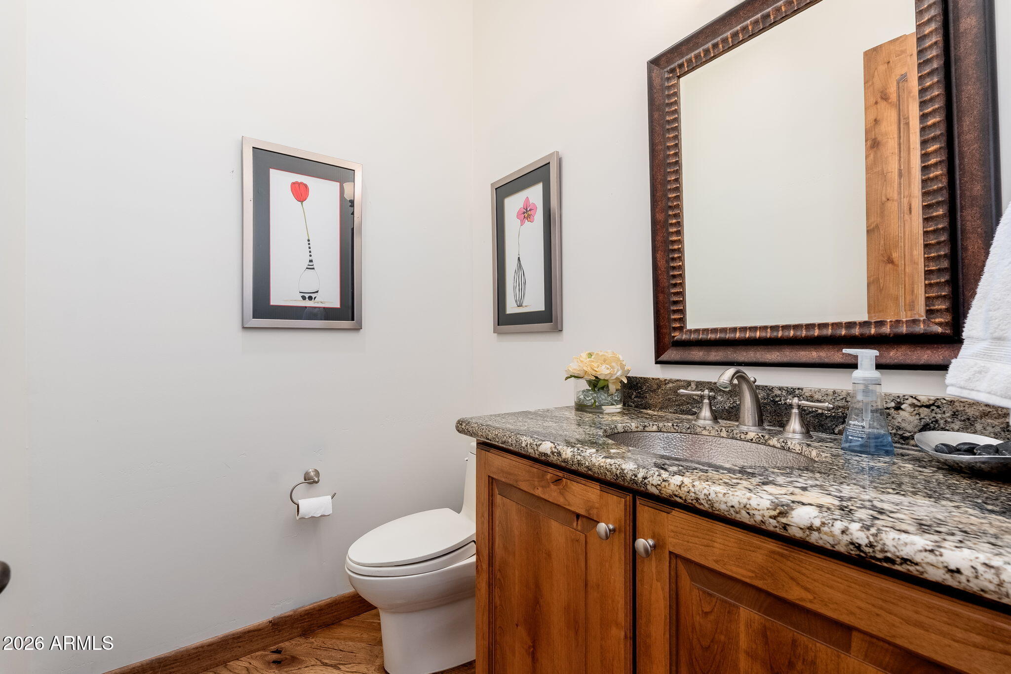 2208 East Filaree Circle Payson, AZ 85541 - Photo 29 of 60 a bathroom with a granite countertop toilet sink and mirror