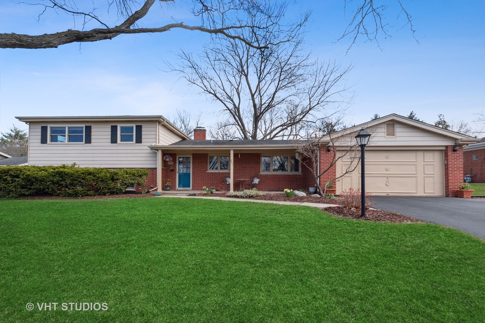 a front view of a house with a garden